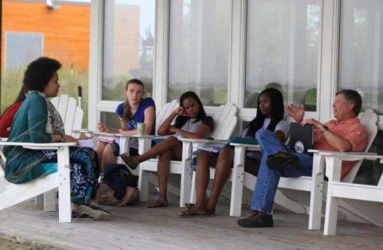 students in class on front porch