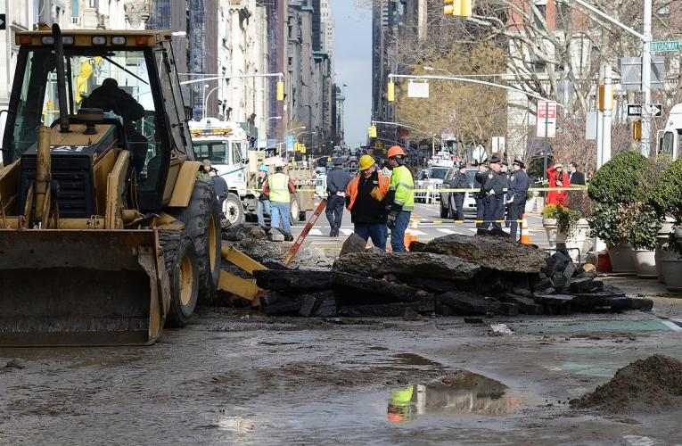 MTA workers in New York City supervise water main repair