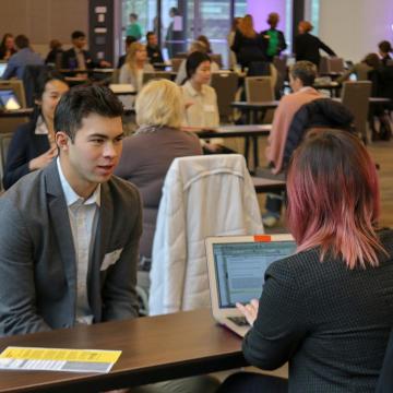 Student interviewing at an event